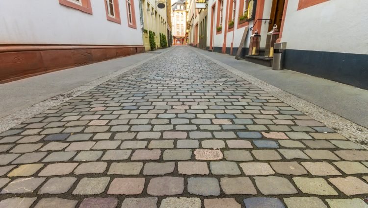 Beautiful view of scenic narrow street with historic traditional houses and cobbled street in an old